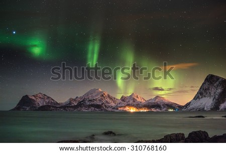 Aurora borealis (Polar lights) over the mountains in the North of Europe - Lofoten islands, Norway