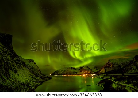 Aurora borealis (Polar lights) over the mountains in the North of Europe - Lofoten Islands, Norway