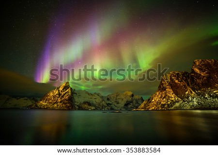 Aurora borealis (Polar lights) over the Lilandstinden mountain peak - Reinefjorden, Lofoten islands, Norway
