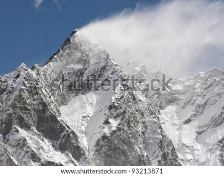 Snow flags on the top of the Lhotse (8516m) - Mt. Everest region