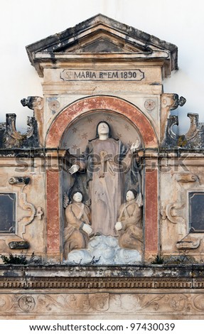 The gate sculpture of the Virgin Mary in the Saint Mary church in the village of Obidos - Portugal