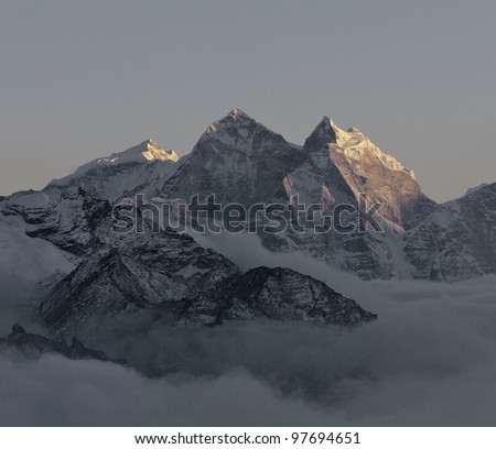 The last rays of the sun on the tops of the mountains in the area of the Everest - Nepal