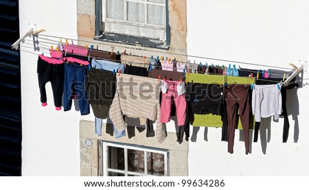 The house drying clothes on a small street in the old quarter of Ribeira - Porto, Portugal