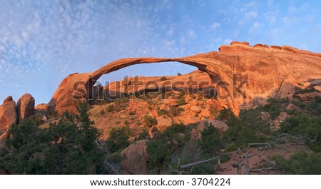 Sunrise lit Landscape Arch in Arches National Park