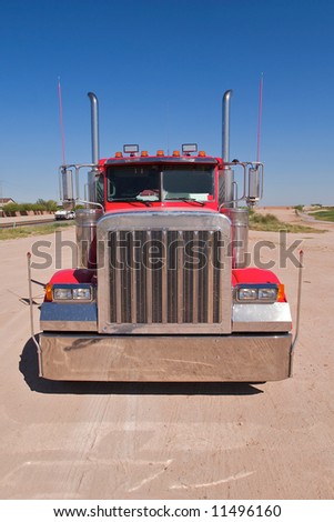 Front of Red truck with blue sky.