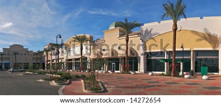 New outdoor mall with palms.