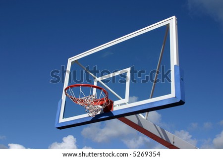 Basketball basket on blue sky background.
