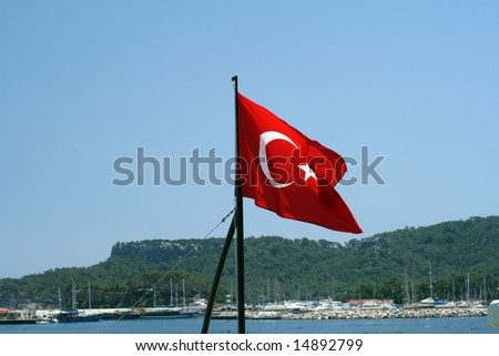 Turkish flag. Yacht and mountains in a background.