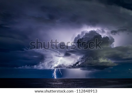 Lightning in the sea during the night storm