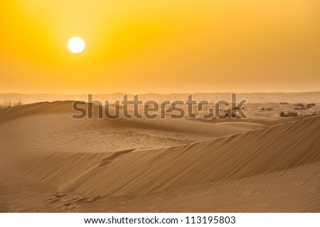 Sunset with sand dunes in desert