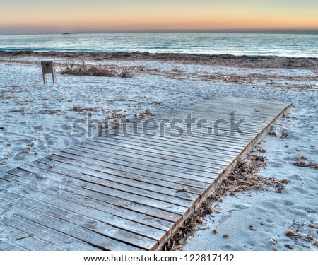 boardwalk by the sea at sunset in hdr toning