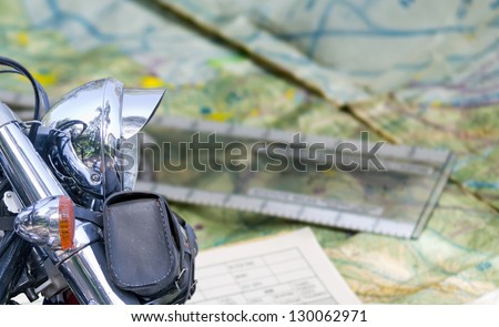 chromed motorcycle with road map on the background