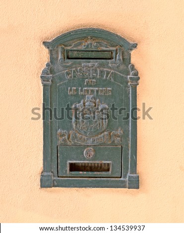 old mail box on yellow wall