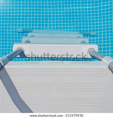 pool ladder and water seen from above