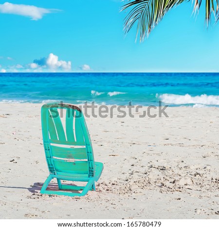 aqua marina chair in a tropical beach