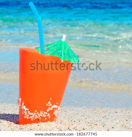 orange drink by the sea