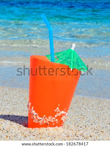 orange drink by the sea