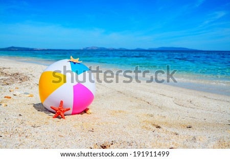 beach ball by a turquoise shore in Sardinia