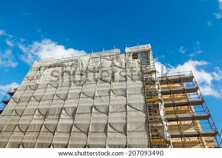 building facade covered for restoration work