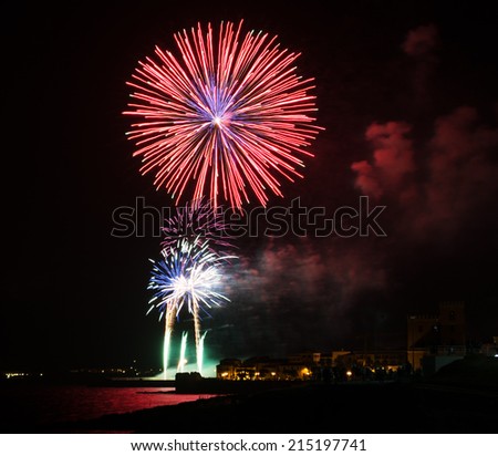 red fireworks in Alghero on a summer night