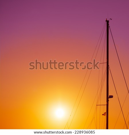 boat mast silhouette under a colorful sunset. Shot in Alghero, Italy