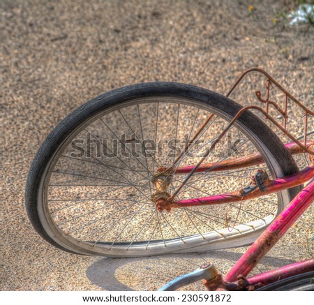 Close up of a broken bicycle wheel. Heavy processed for hdr tone mapping effect