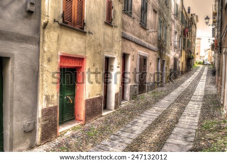 narrow road in Alghero old town. Processed for hdr tone mapping effect.