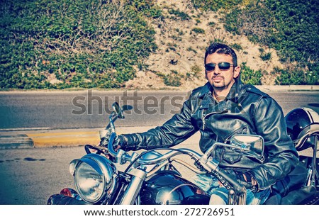 biker on a classic motorcycle in hdr tone mapping effect