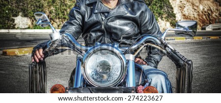 biker on a classic motorcycle in vintage tone effect
