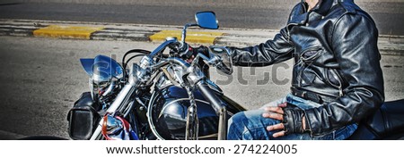 side view of a biker on a classic motorcycle in hdr