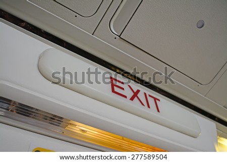 emergency exit sign in a commercial airplane