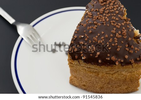 typical Italian Christmas cake with chocolate on a white plate