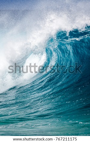 Close up of a breaking Ocean wave at Waimea bay on the north shore of Oahu Hawaii