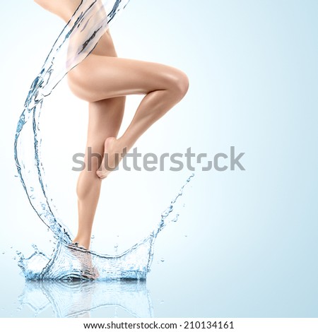 Design of young woman body with clean water splash