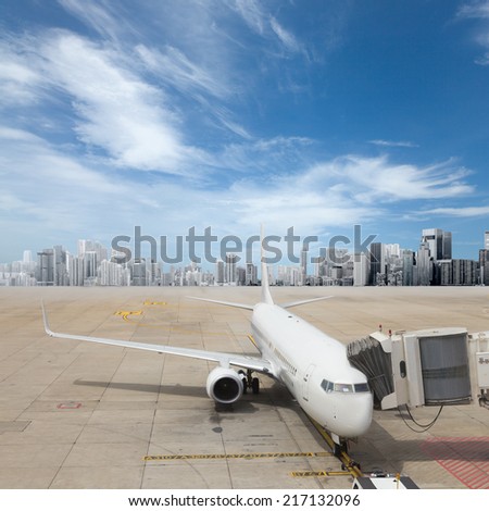 Passenger plane at airport near boarding terminal