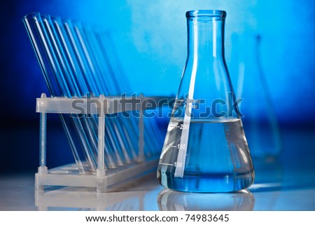 Abstract laboratory glassware equipment over blue background