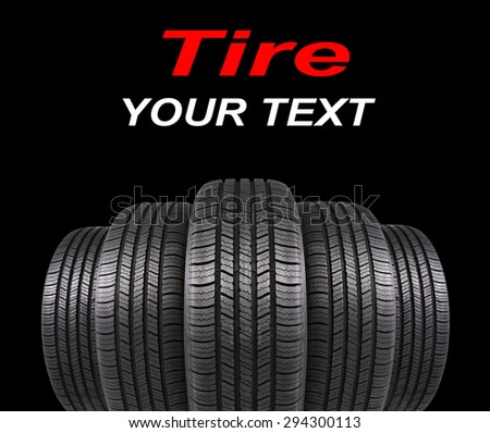 five automobile rubber tires isolated on black background