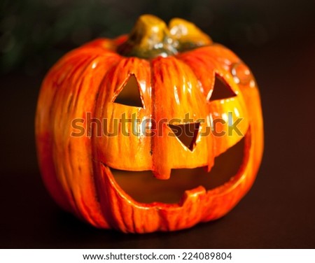 Halloween pumpkin head in dark, scary smile. Light inside.