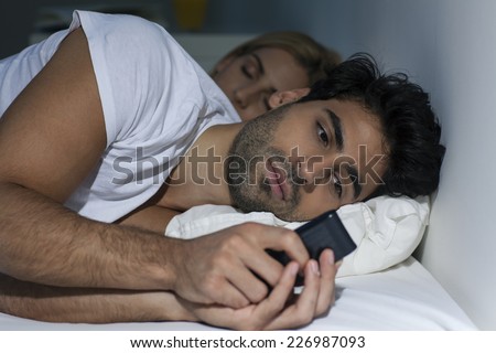 Man texting late at night.