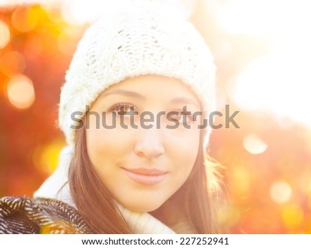 Beautiful girl smiling and enjoying winter sunshine