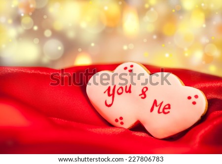 Cute heart shaped Valentine's cookie with You & Me written on it.