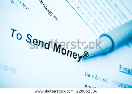 Close up - sending money via Western Union, filling a form