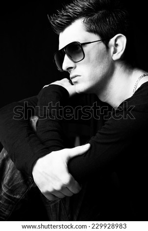 Young male fashion model posing - black and white