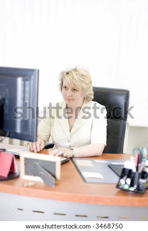 Mid-life business woman working on computer