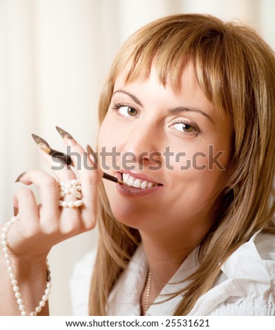 Portrait of 40 years old smiling woman with manicure
