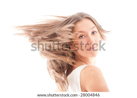 Portrait of attractive girl with fly-away hair on the wind. Isolated on white