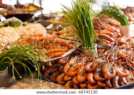 Ingredients for traditional thai cuisine and fresh seafood on fish market in Bangkok. Thailand