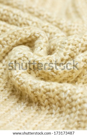 knitted background beige closeup