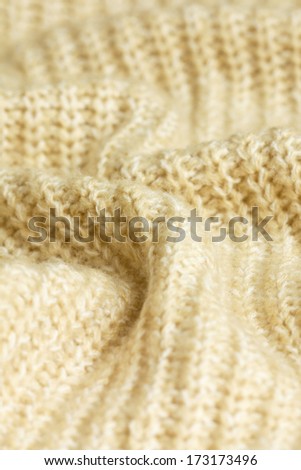 knitted background beige closeup