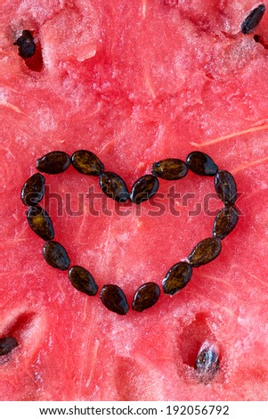 heart of the watermelon seeds on the background of watermelon flesh